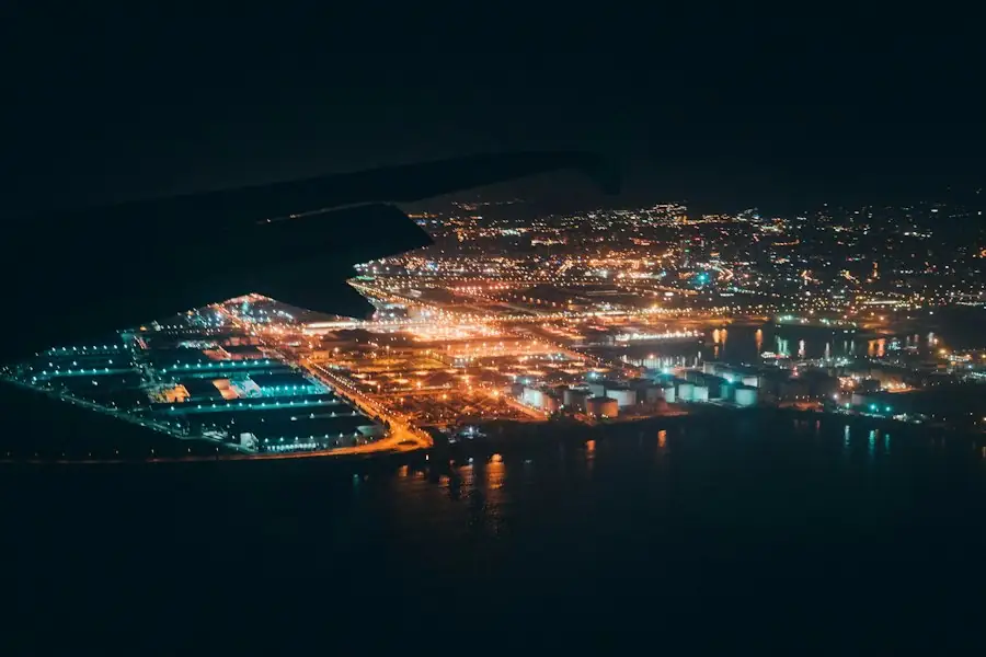 City and harbor lights at night from the air