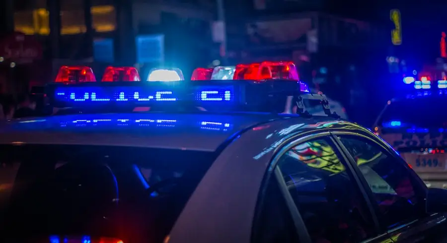 Patrol vehicle with emergency lights at night