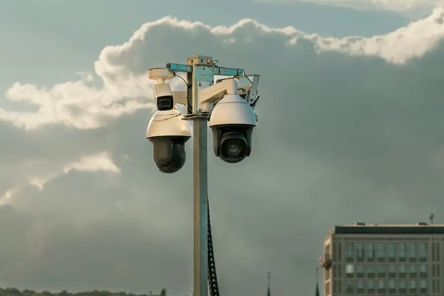 Cameras mounted high on a mast against the sky