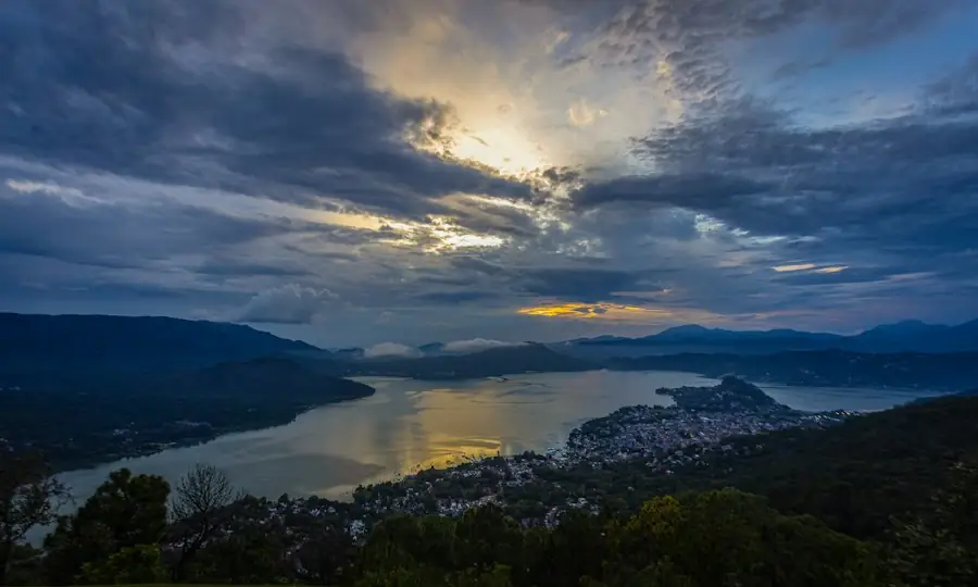Lakeside town at dusk seen from the hills